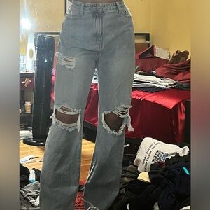 Never worn light wash distressed ripped blue jeans